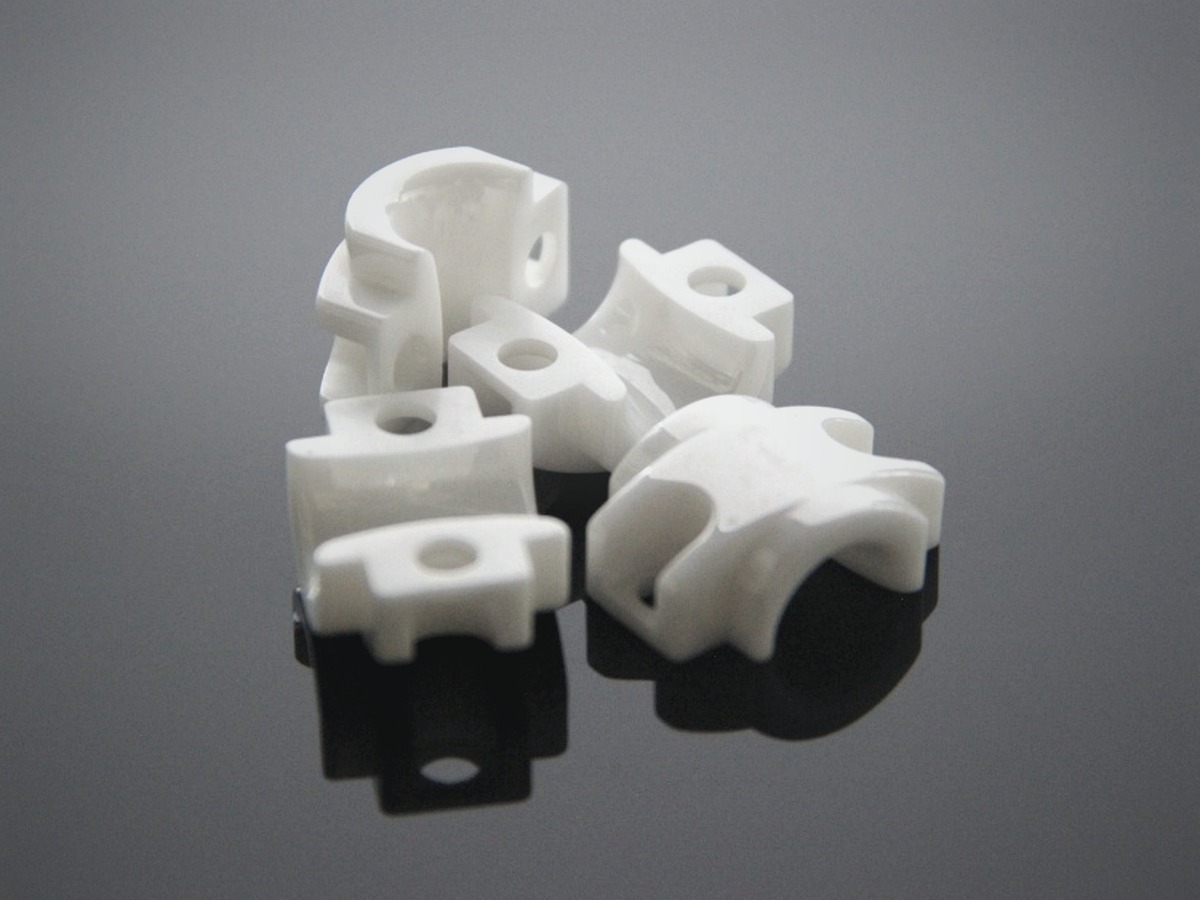 White specialty ceramic fixtures on a graphite surface